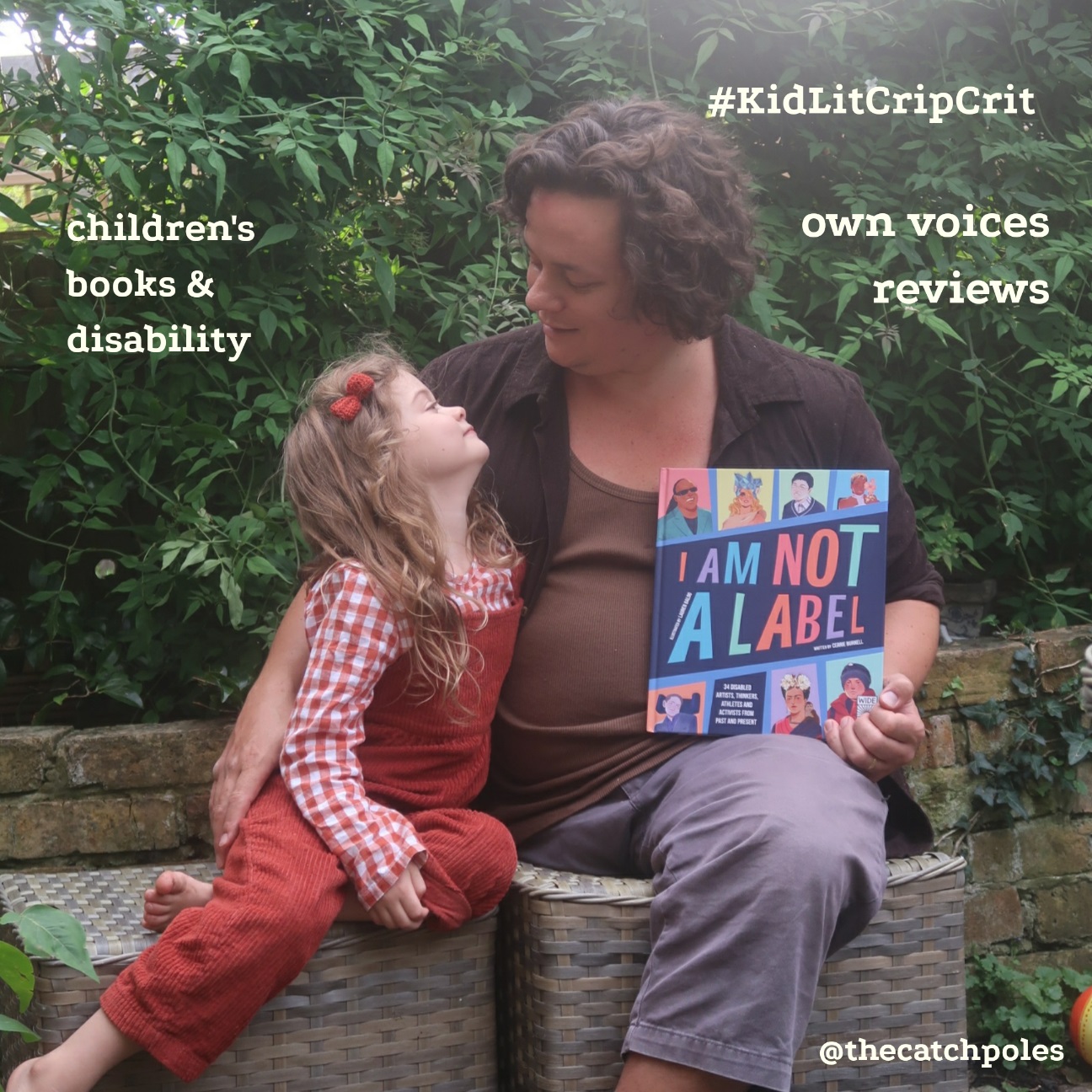 Mainie (5) is sitting next to her dad James - a one legged white man. He's holding I Am Not A Label. Text reads: '#KidLitCripCrit; disability & children's books'
