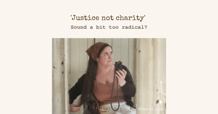 A photo of me in my wheelchair - I’m a white woman with long hair, wearing a bandana in my hair.