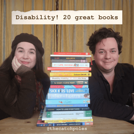 A photo of Lucy and James, sitting with a pile of books from the disabled authors list
