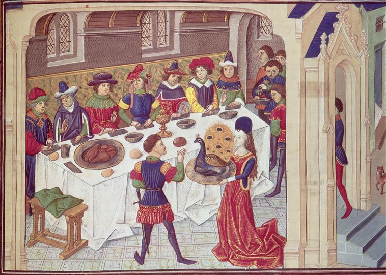 A medieval scene of feasting, with a woman carrying a peacock on a platter at its centre. From a C15th manuscript - The Romance of Alexander the Great -The Vows of the Peacock
