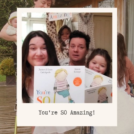 Lucy and James and their daughters hold copies of 'You're SO Amazing!' They do not look very inspiring.