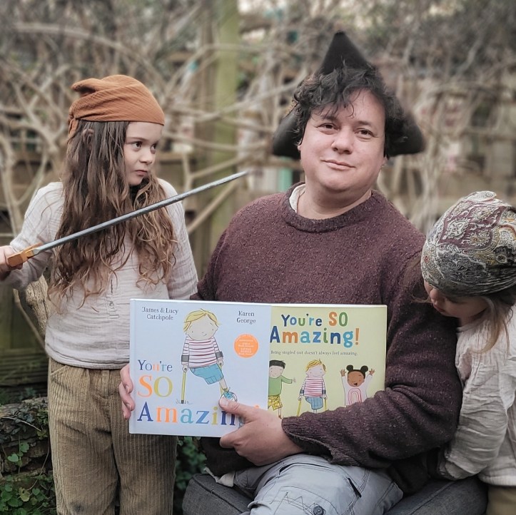 James and his daughters with 'You're SO Amazing!'